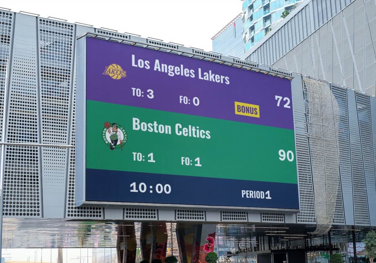 An outdoor basketball scoreboard. The scoreboard is being controlled by a web-browser